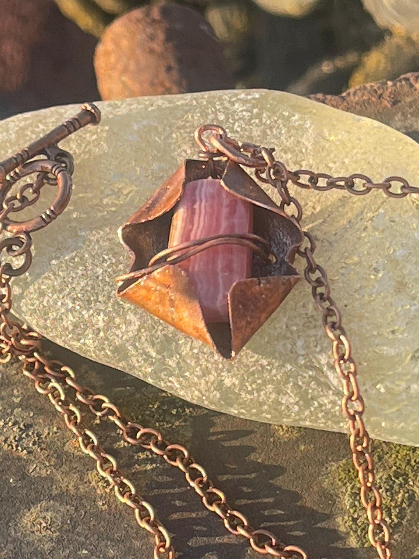 Eco friendly handmade necklace made from Rhodochrosite & naturally weathered recycled copper. Ethical jewellery. Unique handmade jewellery.