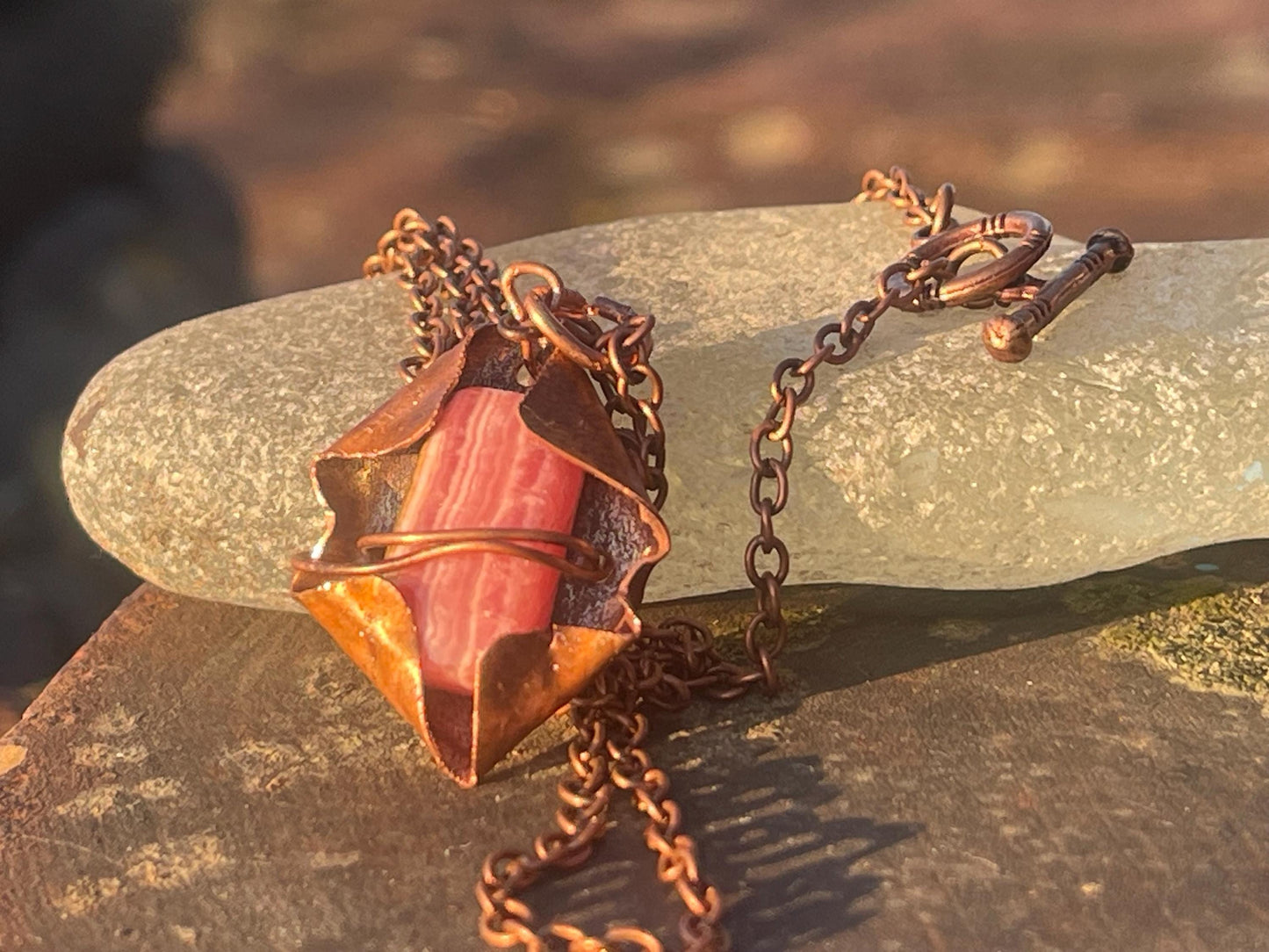 Eco friendly handmade necklace made from Rhodochrosite & naturally weathered recycled copper. Ethical jewellery. Unique handmade jewellery.