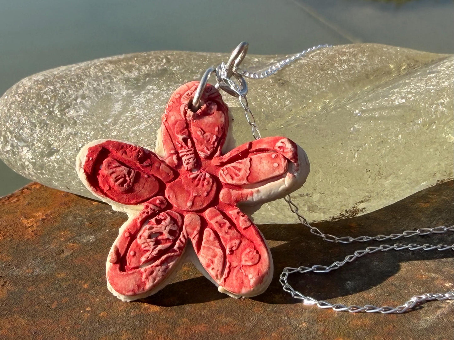 Handmade ceramic flower necklace on a recycled sterling silver chain. Eco friendly jewellery, ethical jewellery, eco necklaces.