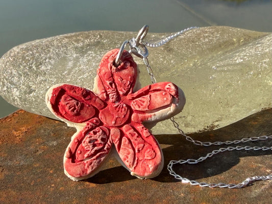 Handmade ceramic flower necklace on a recycled sterling silver chain. Eco friendly jewellery, ethical jewellery, eco necklaces.