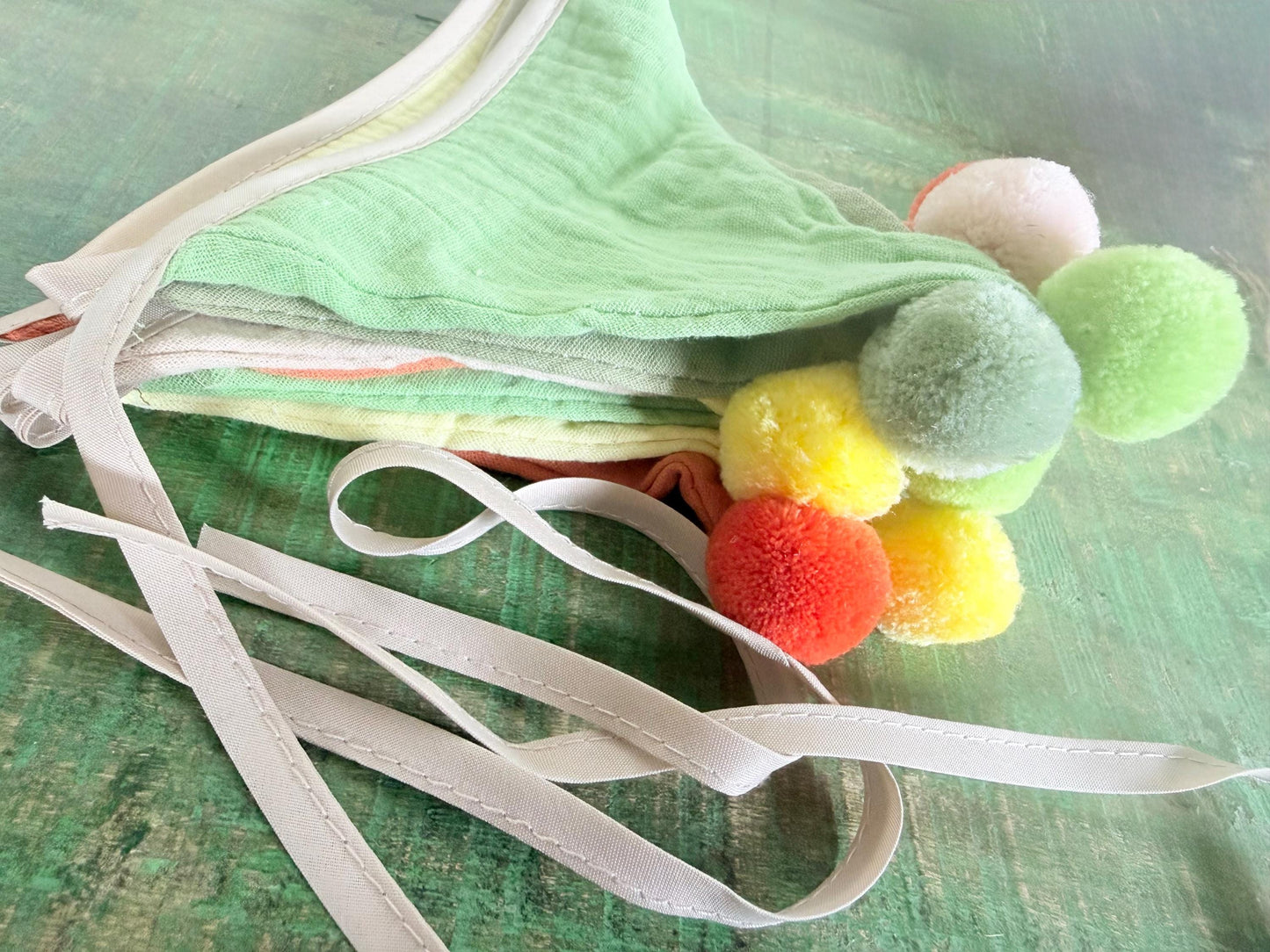 Cotton Pom Pom bunting in lovely earthy tones. Autumnal bunting. Cotton bunting with long ties. Boho bunting for home, garden and parties