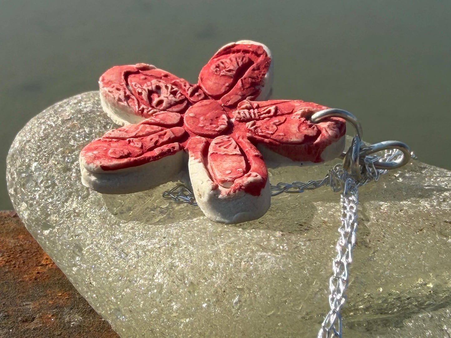 Handmade ceramic flower necklace on a recycled sterling silver chain. Eco friendly jewellery, ethical jewellery, eco necklaces.