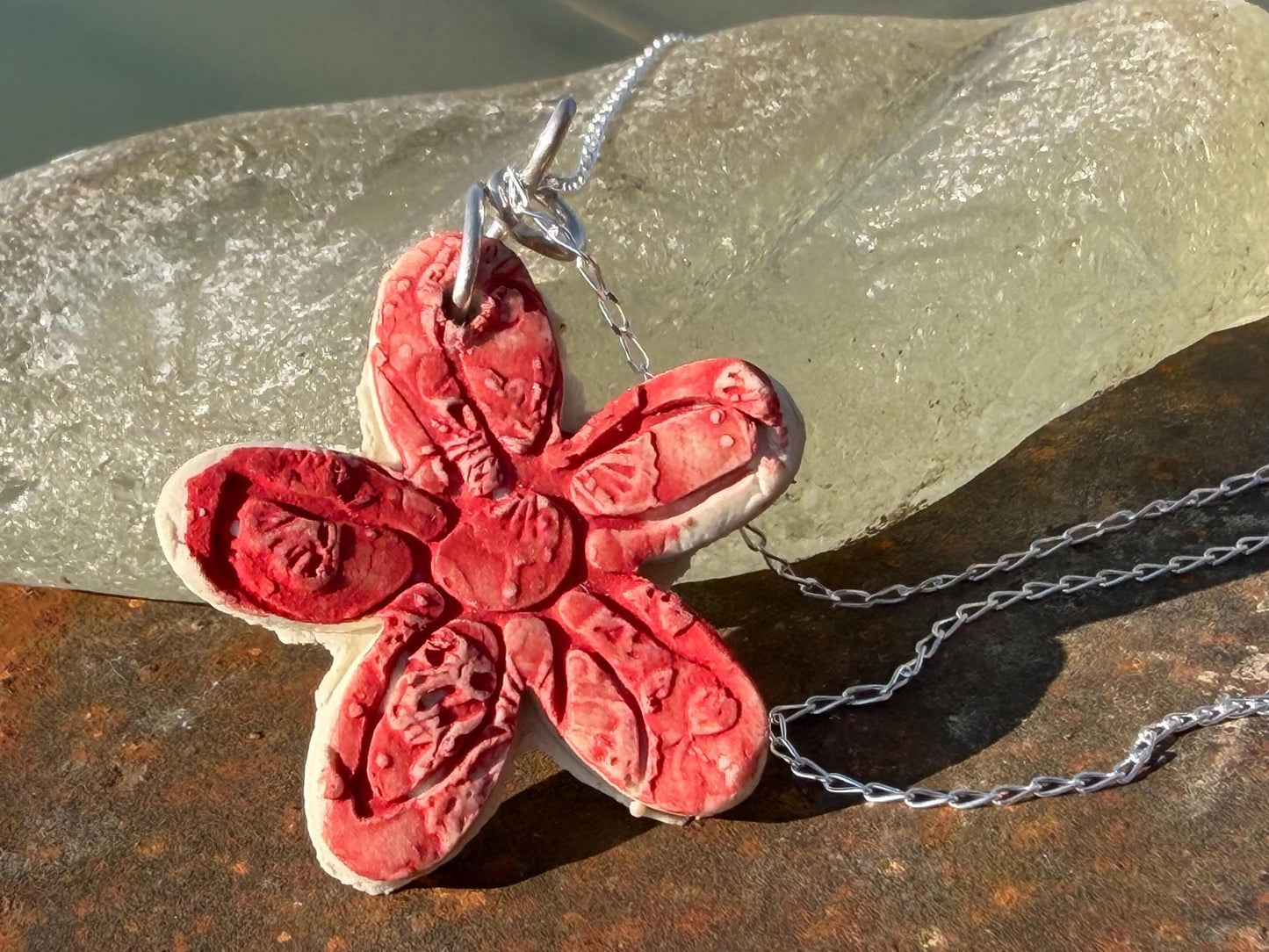 Handmade ceramic flower necklace on a recycled sterling silver chain. Eco friendly jewellery, ethical jewellery, eco necklaces.