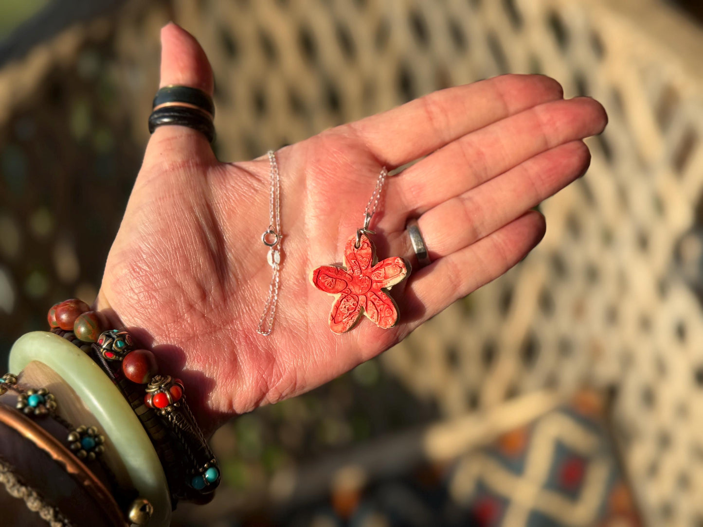Handmade ceramic flower necklace on a recycled sterling silver chain. Eco friendly jewellery, ethical jewellery, eco necklaces.