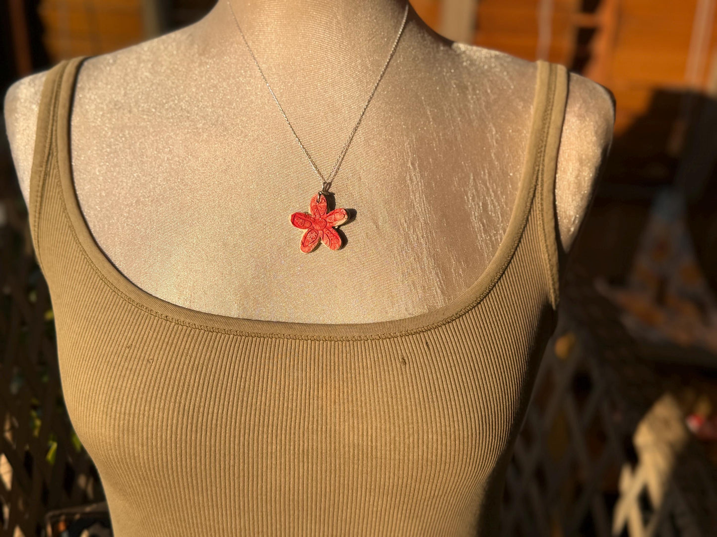 Handmade ceramic flower necklace on a recycled sterling silver chain. Eco friendly jewellery, ethical jewellery, eco necklaces.