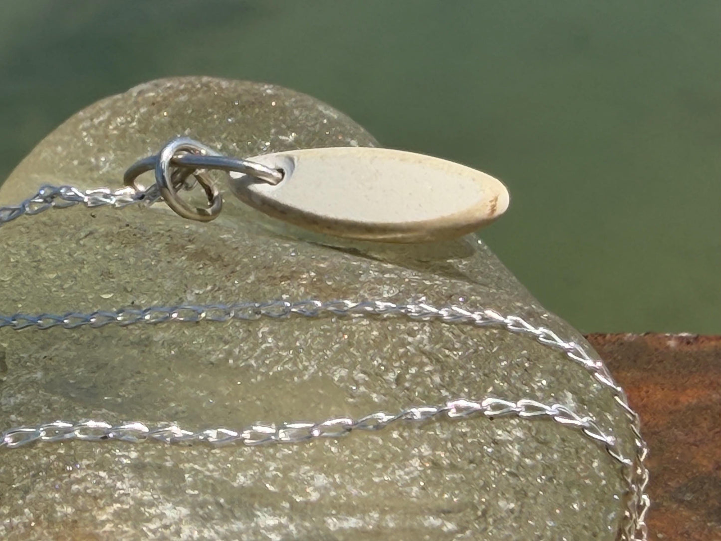 Eco friendly sea ceramic necklace on a sterling silver chain. Eco friendly jewellery, ethical jewellery. Eco friendly necklace.