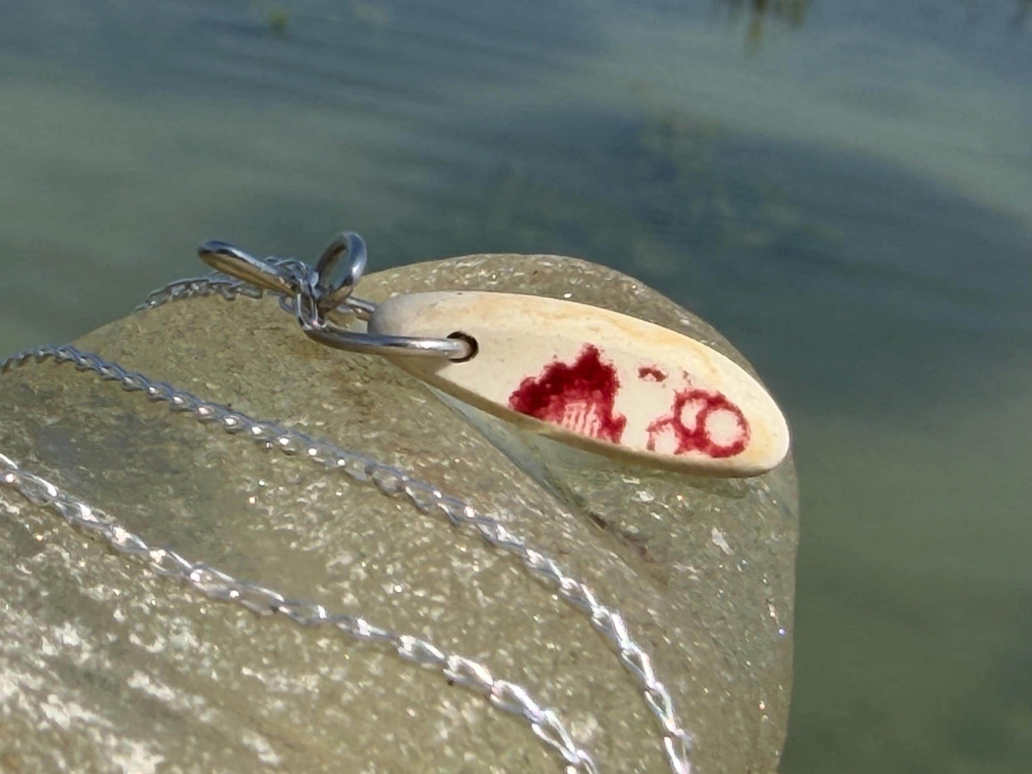 Eco friendly sea ceramic necklace on a sterling silver chain. Eco friendly jewellery, ethical jewellery. Eco friendly necklace.