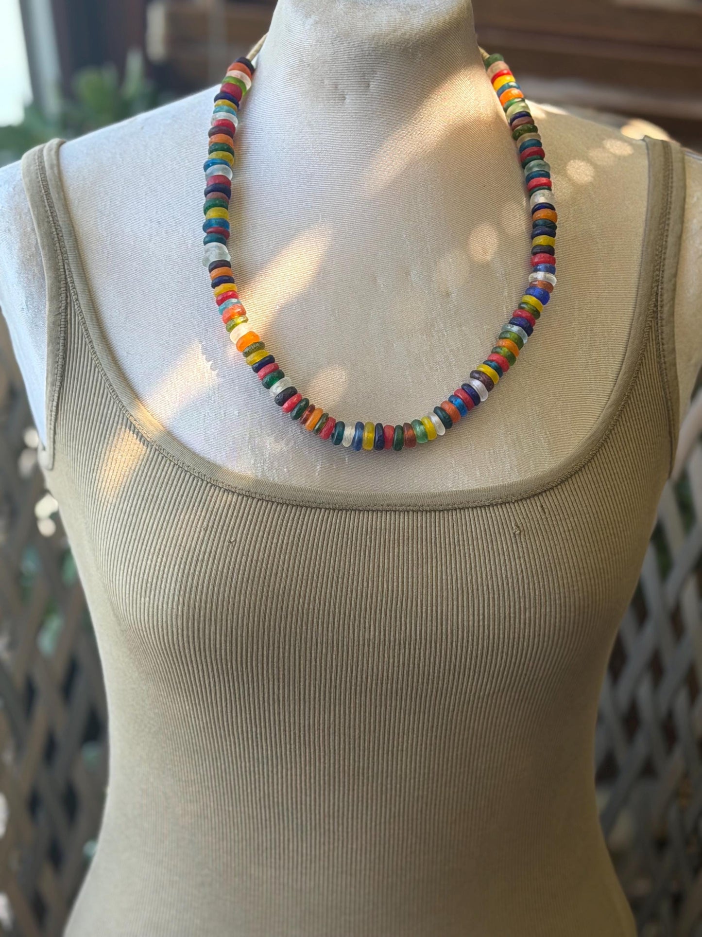 Eco friendly necklace made from recycled glass and hung in raffia. Ethical jewellery that doesnt cost the earth! Sustainable, eco gifts