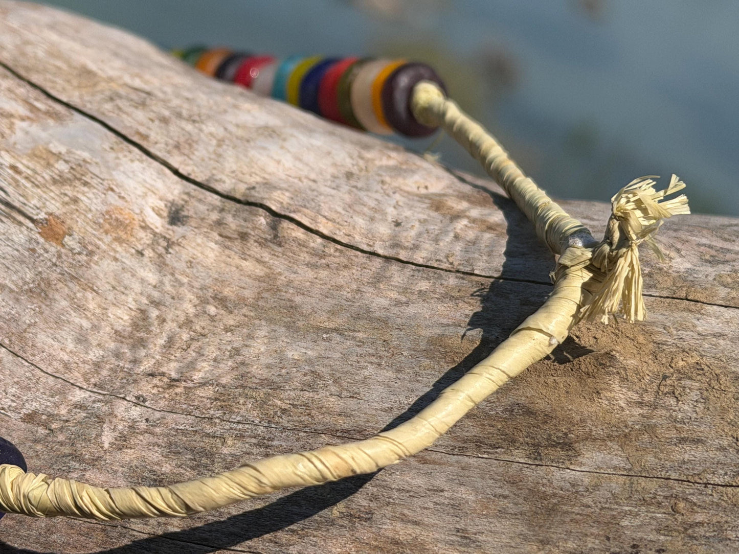 Eco friendly necklace made from recycled glass and hung in raffia. Ethical jewellery that doesnt cost the earth! Sustainable, eco gifts