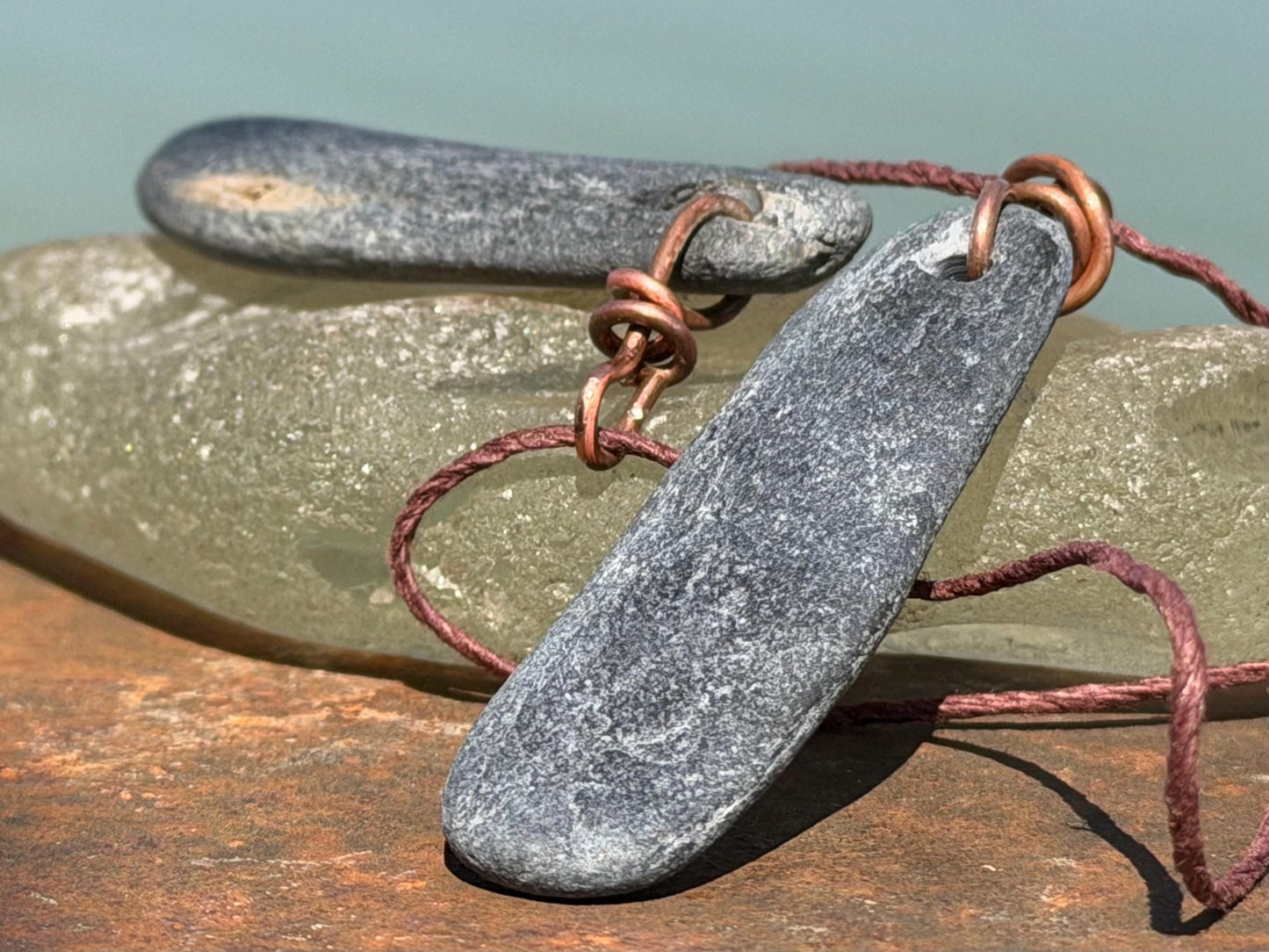 Eco friendly Cornish slate pendants. Earthy, eco and sustainable gift for him. Handmade frey slate necklaces. Handcrafted gifts for men.