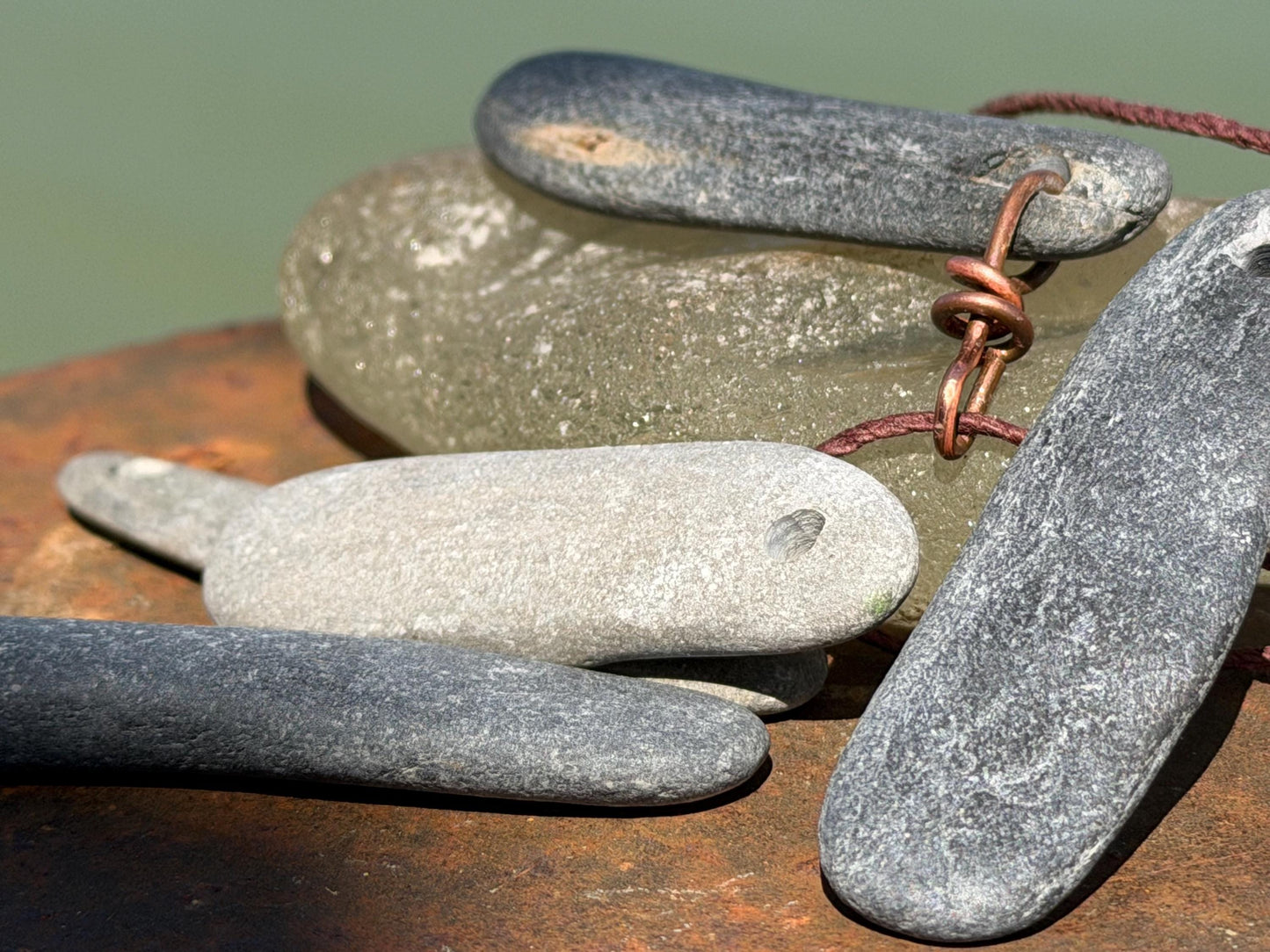 Eco friendly Cornish slate pendants. Earthy, eco and sustainable gift for him. Handmade frey slate necklaces. Handcrafted gifts for men.