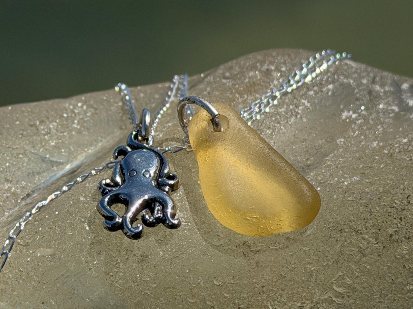 Eco friendly sea glass necklace on a sterling silver chain showcasing a little octopus. Octopus pendant, octopus necklace, eco jewellery