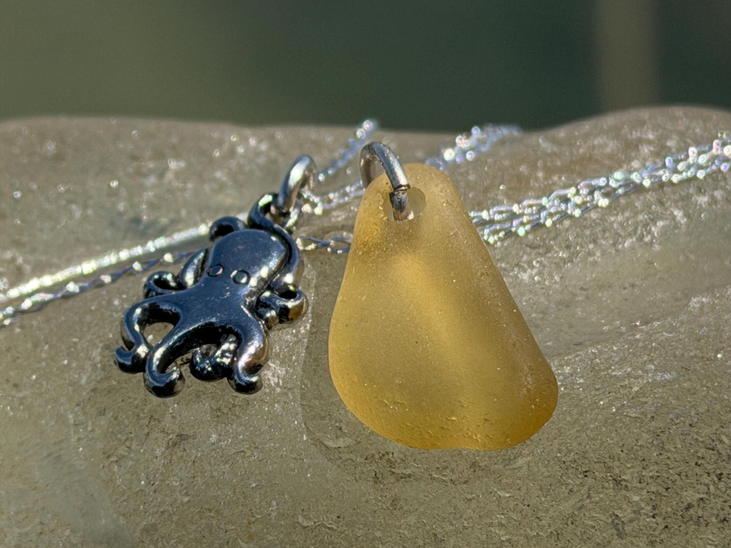 Eco friendly sea glass necklace on a sterling silver chain showcasing a little octopus. Octopus pendant, octopus necklace, eco jewellery