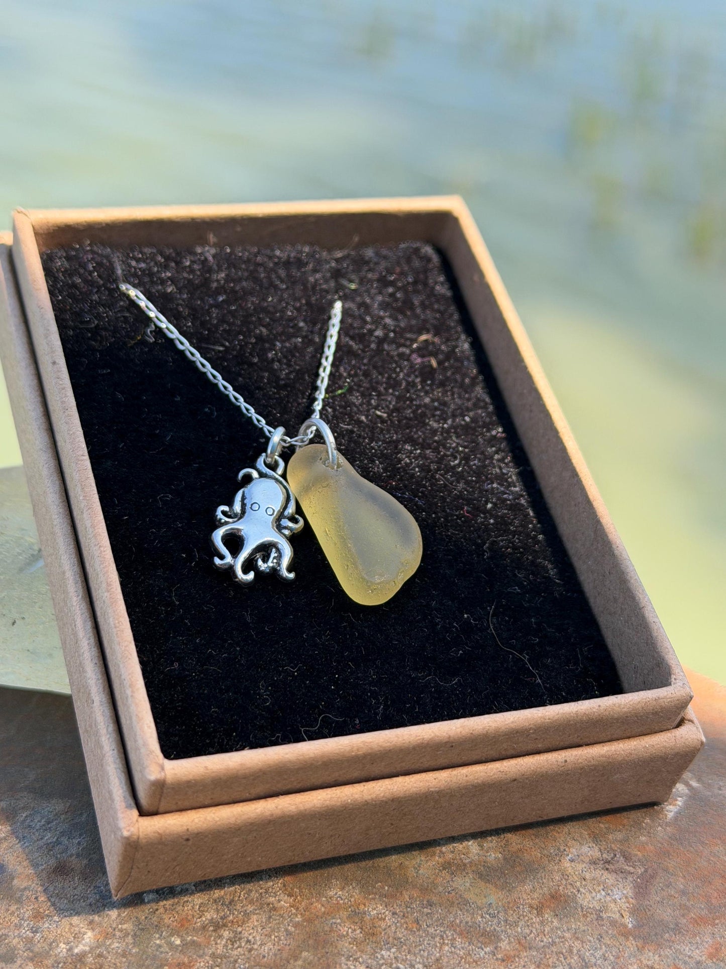 Eco friendly sea glass necklace on a sterling silver chain showcasing a little octopus. Octopus pendant, octopus necklace, eco jewellery