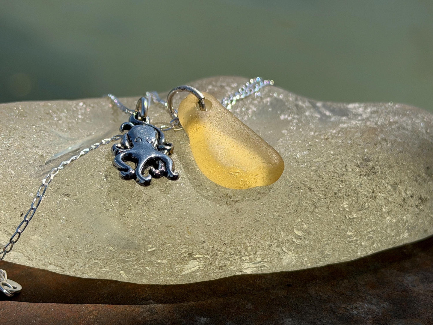 Eco friendly sea glass necklace on a sterling silver chain showcasing a little octopus. Octopus pendant, octopus necklace, eco jewellery