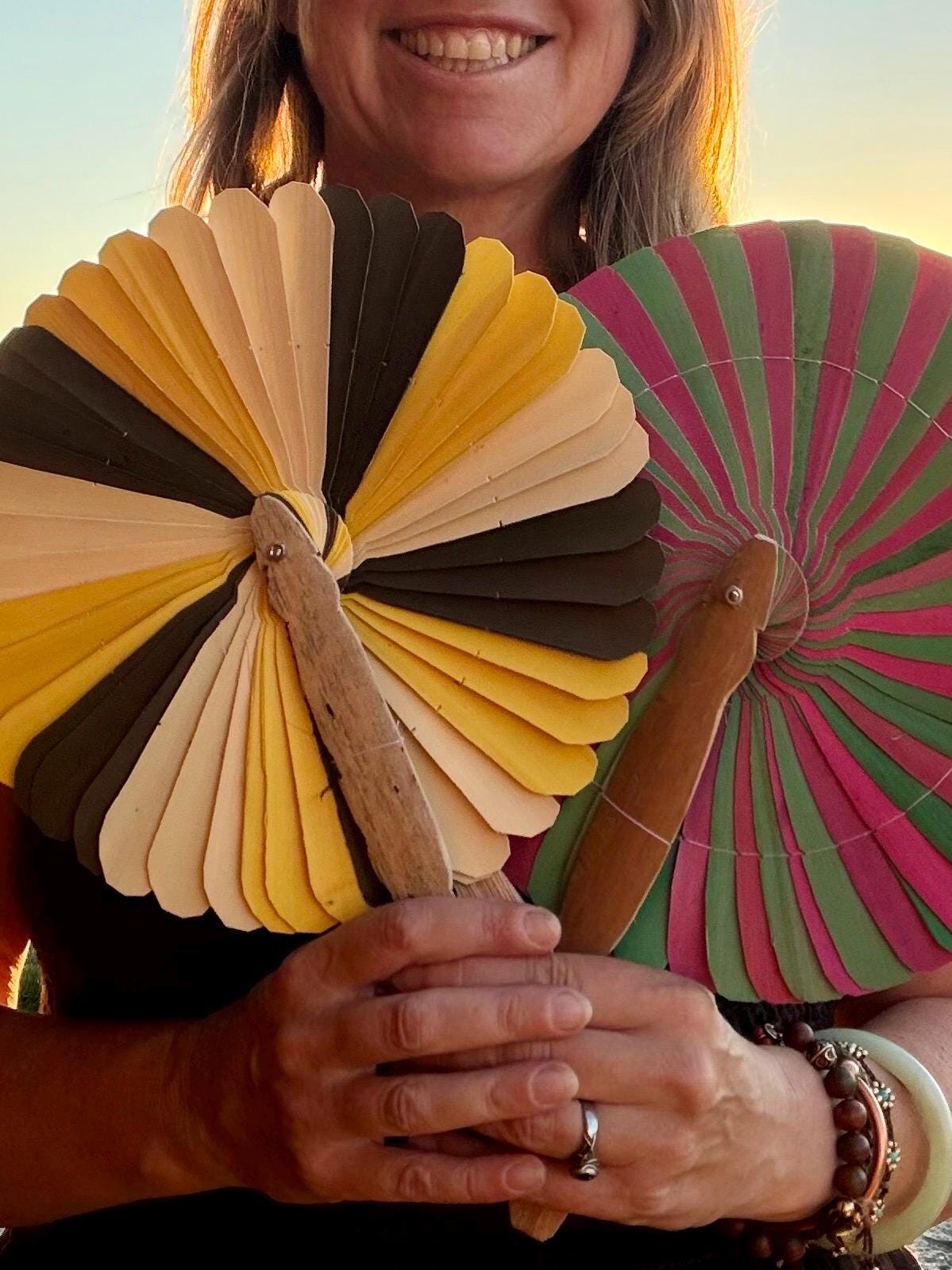 Absolutely beautiful eco friendly handheld bamboo fans. A wide range of colours. Large handmade fans. Eco gifts. Red, orange, green, purple.