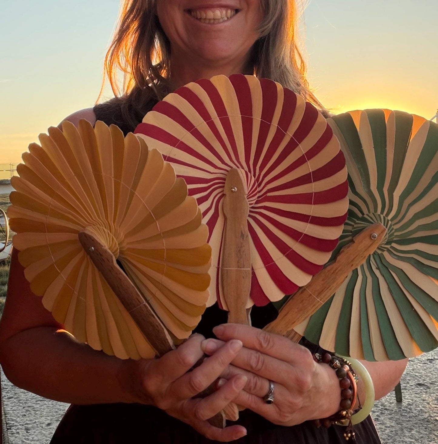Absolutely beautiful eco friendly handheld bamboo fans. A wide range of colours. Large handmade fans. Eco gifts. Red, orange, green, purple.