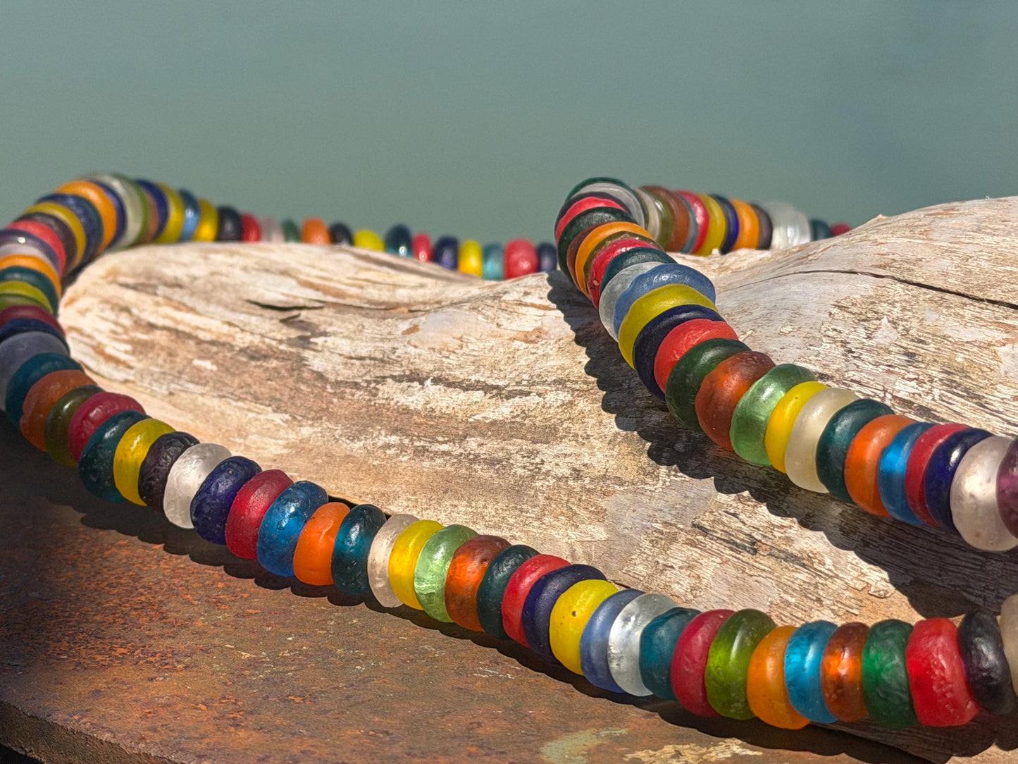 Eco friendly necklace made from recycled glass and hung in raffia. Ethical jewellery that doesnt cost the earth! Sustainable, eco gifts
