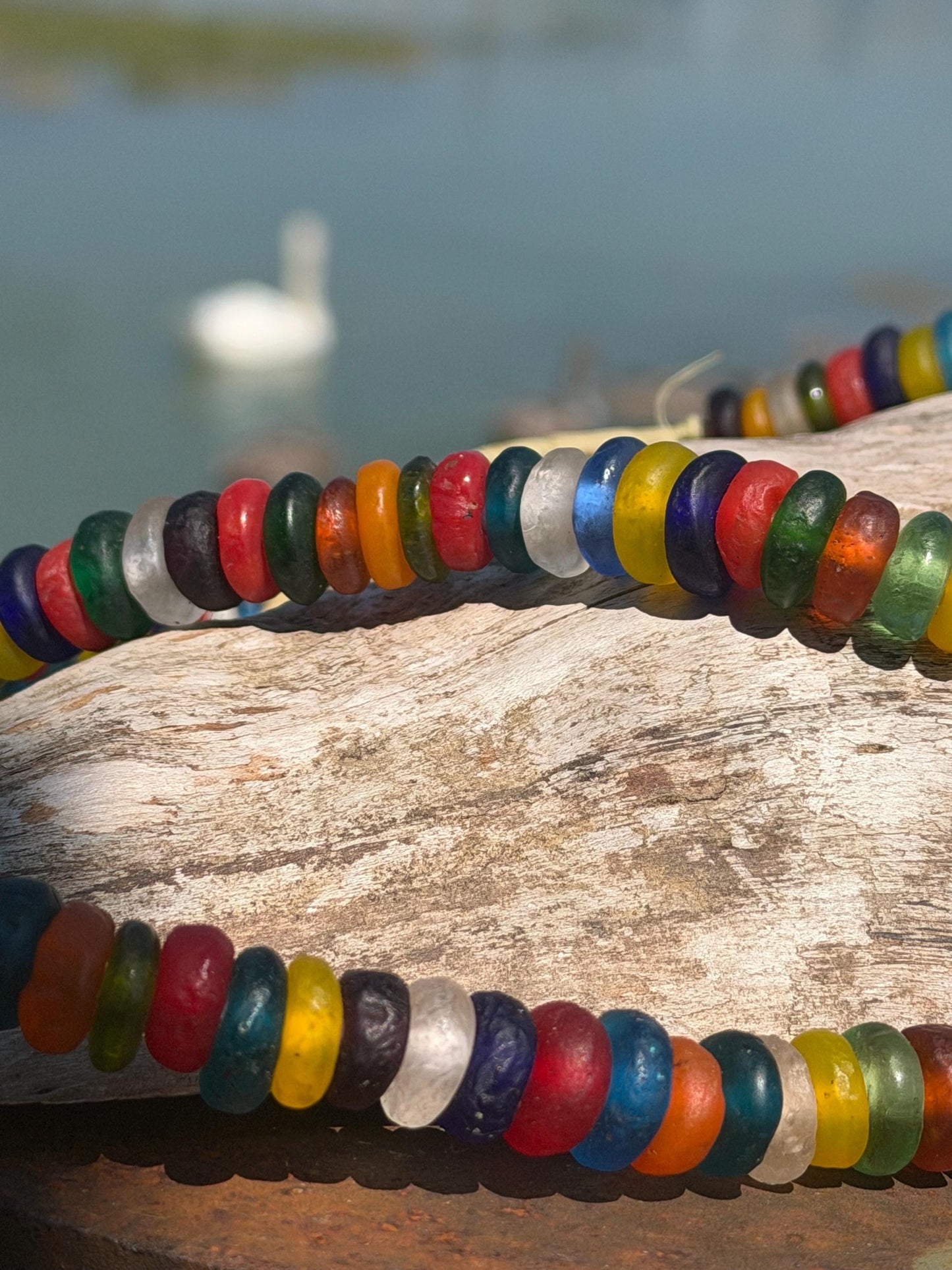 Eco friendly necklace made from recycled glass and hung in raffia. Ethical jewellery that doesnt cost the earth! Sustainable, eco gifts