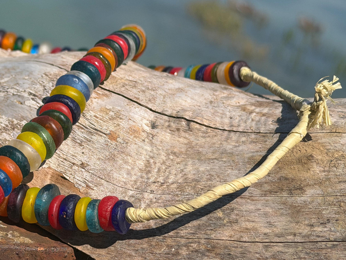 Eco friendly necklace made from recycled glass and hung in raffia. Ethical jewellery that doesnt cost the earth! Sustainable, eco gifts