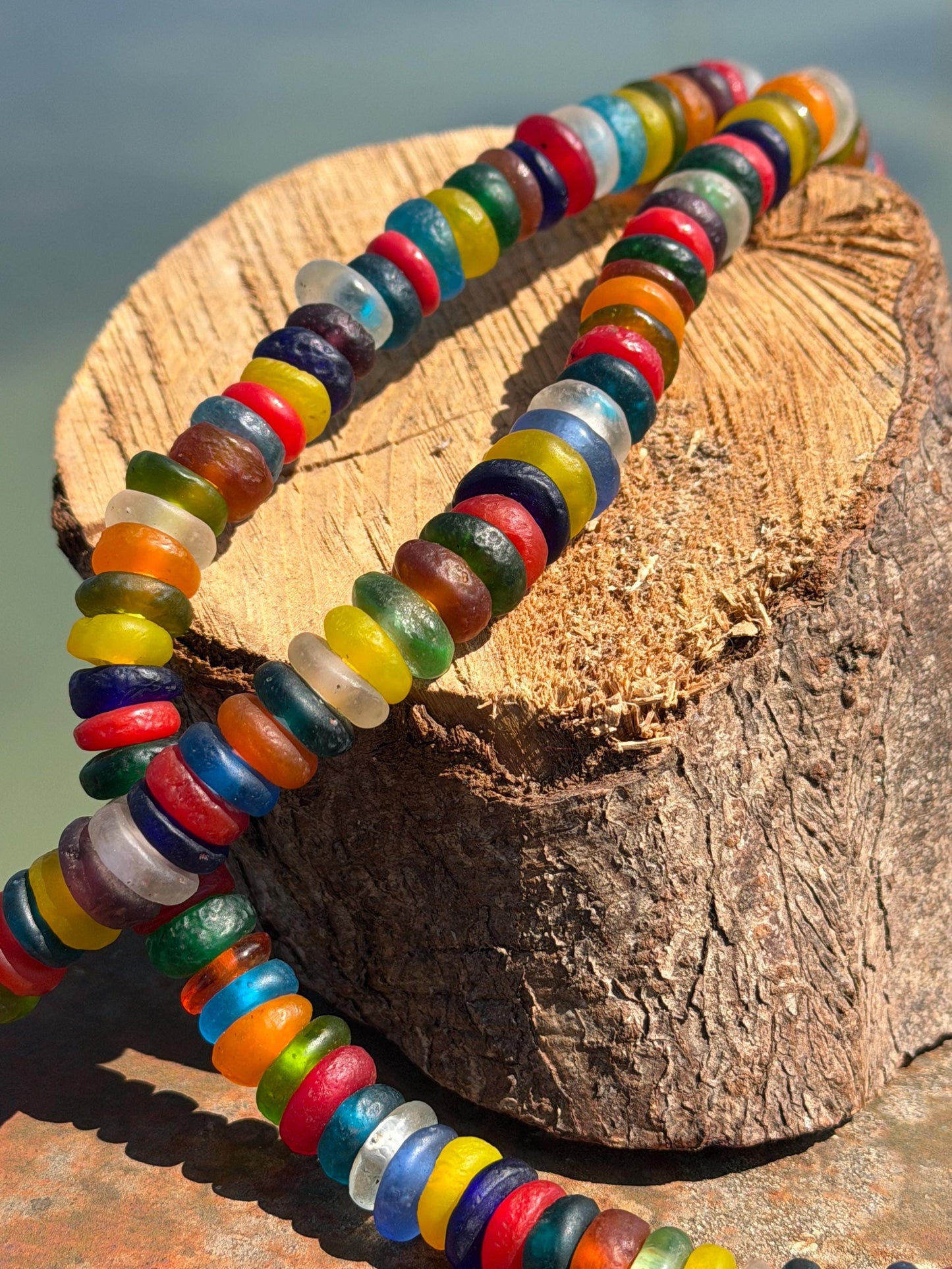 Eco friendly necklace made from recycled glass and hung in raffia. Ethical jewellery that doesnt cost the earth! Sustainable, eco gifts