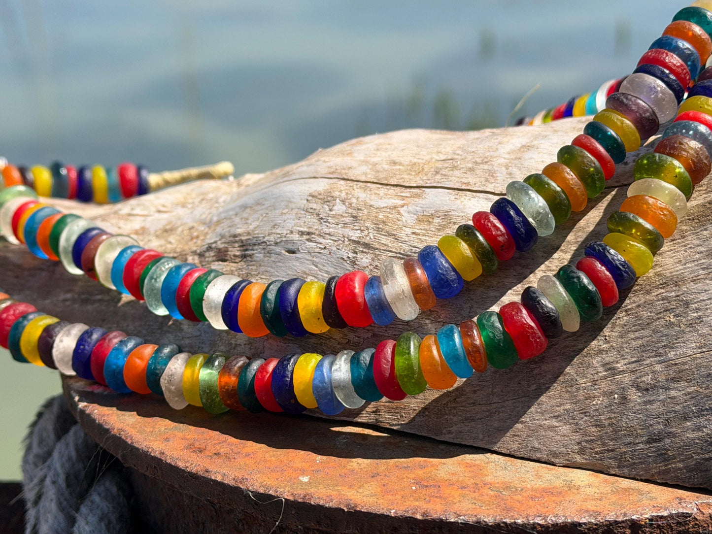 Eco friendly necklace made from recycled glass and hung in raffia. Ethical jewellery that doesnt cost the earth! Sustainable, eco gifts