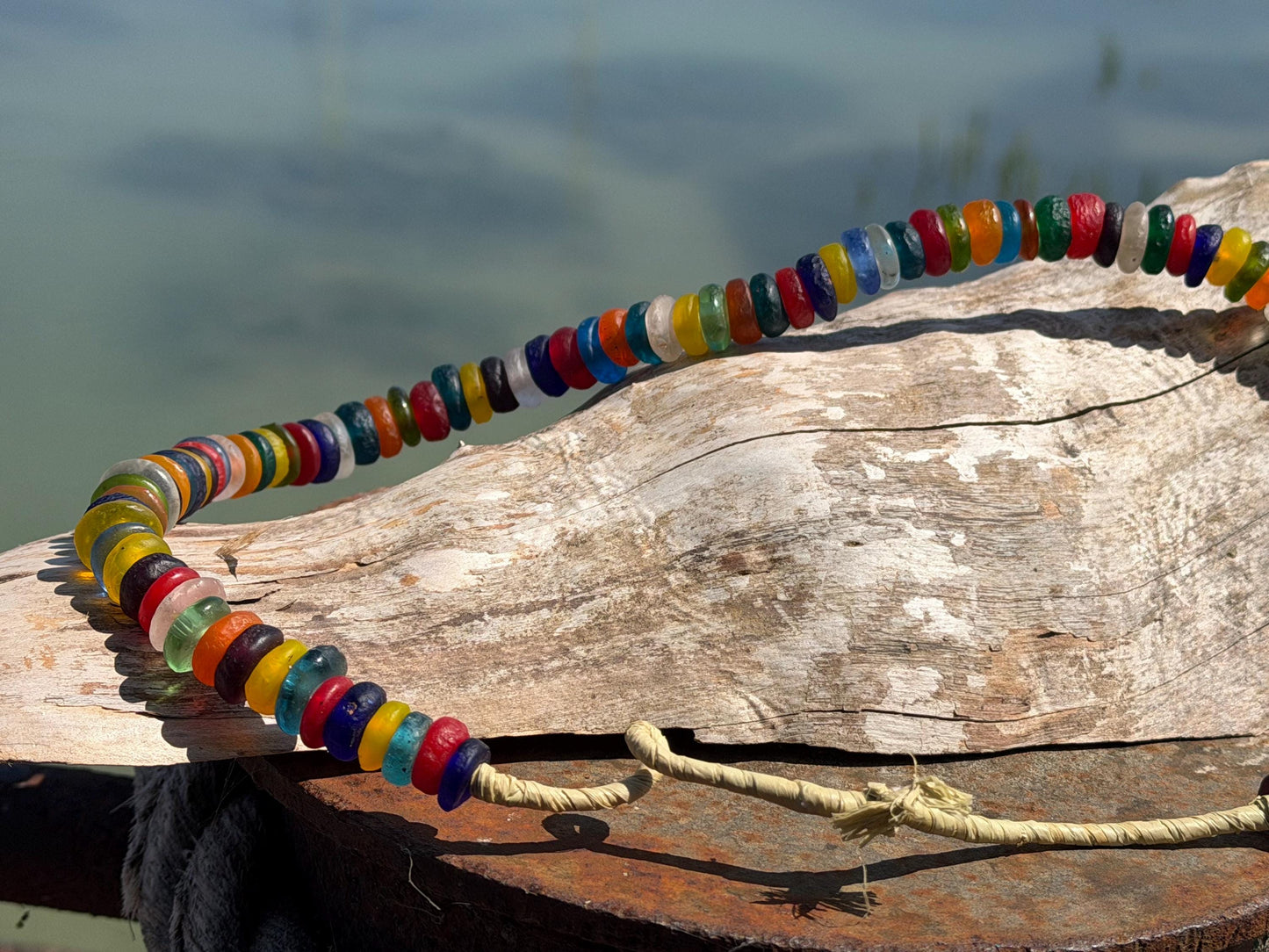 Eco friendly necklace made from recycled glass and hung in raffia. Ethical jewellery that doesnt cost the earth! Sustainable, eco gifts