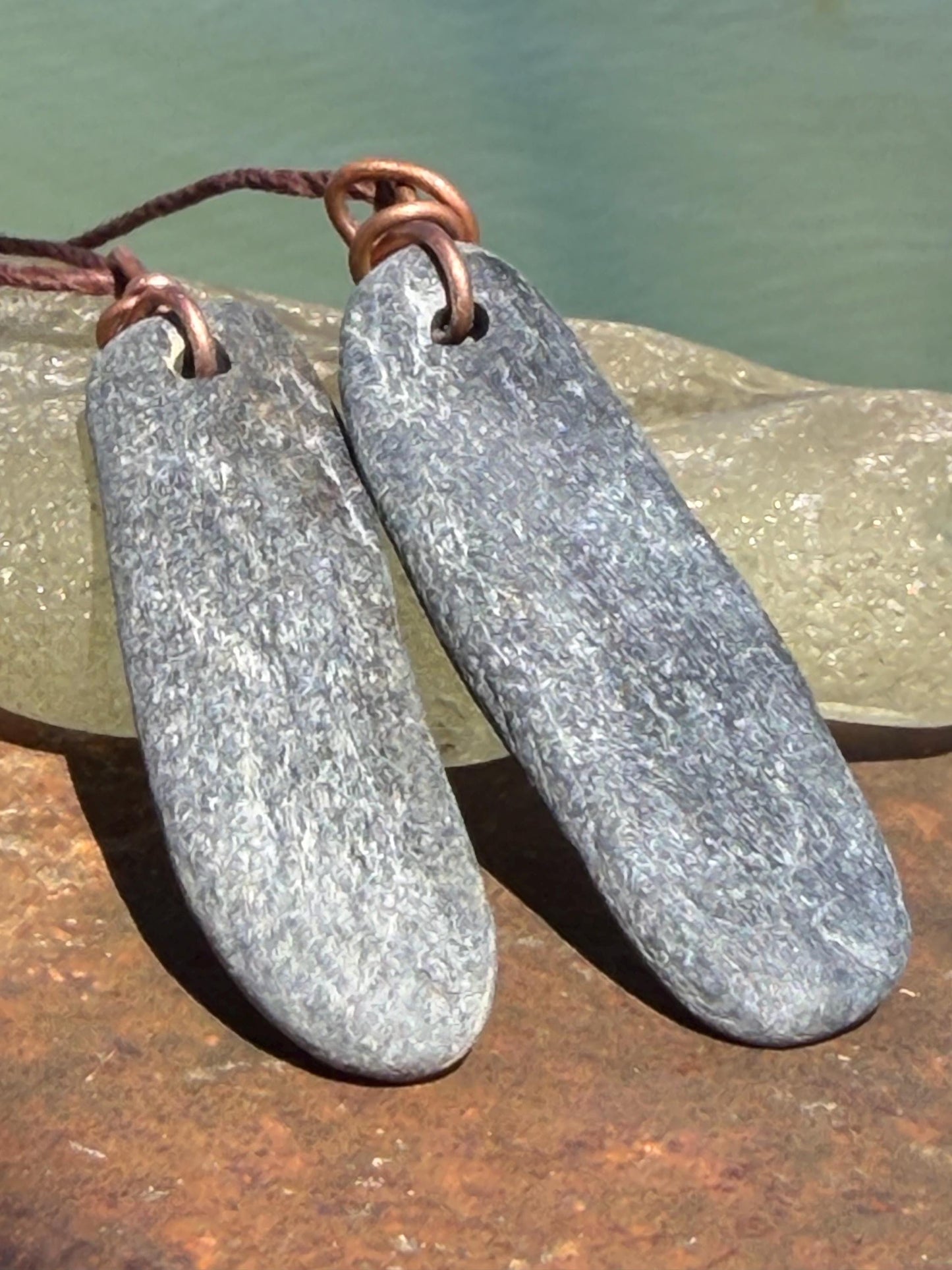 Eco friendly Cornish slate pendants. Earthy, eco and sustainable gift for him. Handmade frey slate necklaces. Handcrafted gifts for men.