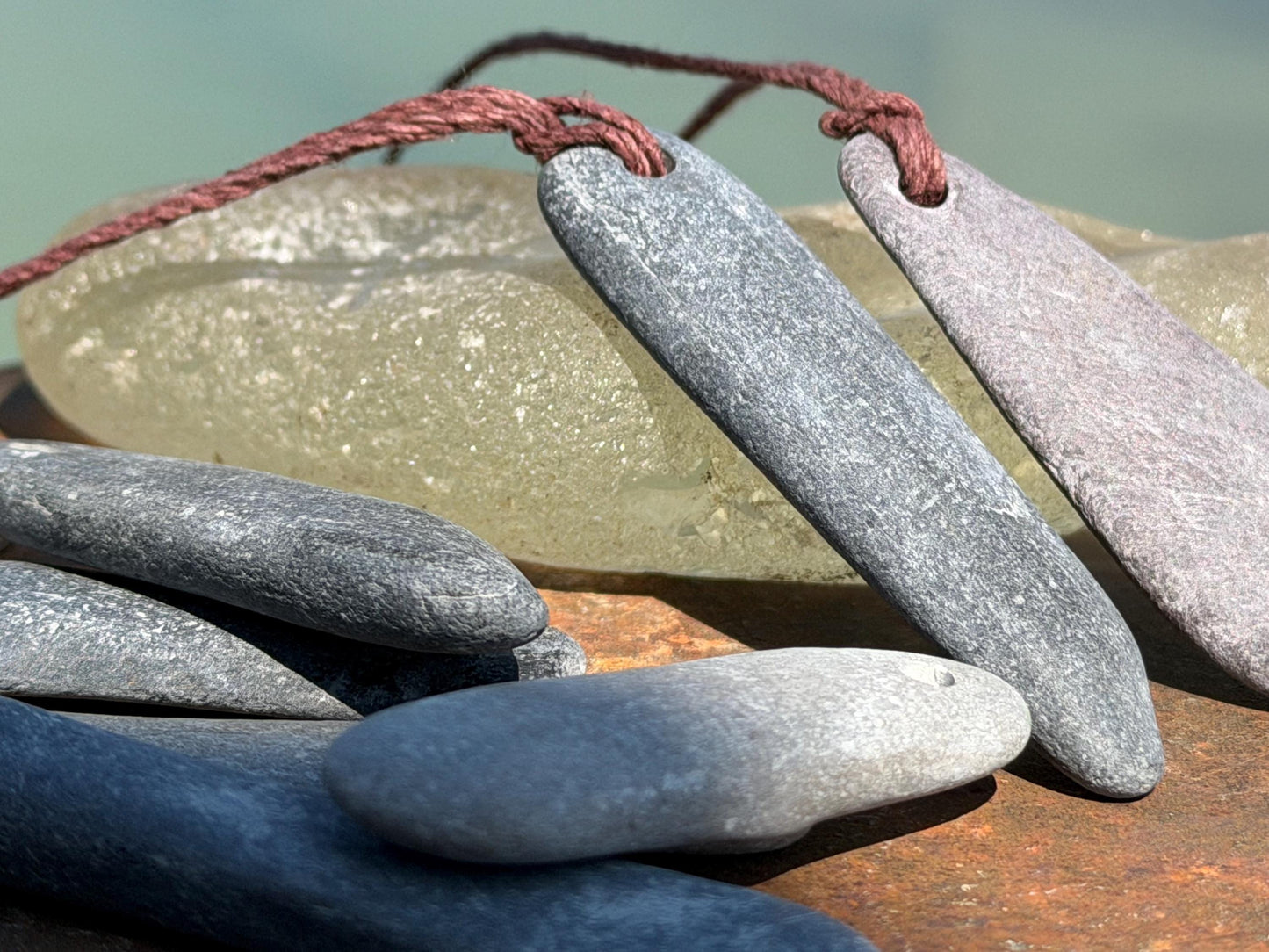 Eco friendly Cornish slate pendants. Earthy, eco and sustainable gift for him. Handmade frey slate necklaces. Handcrafted gifts for men.