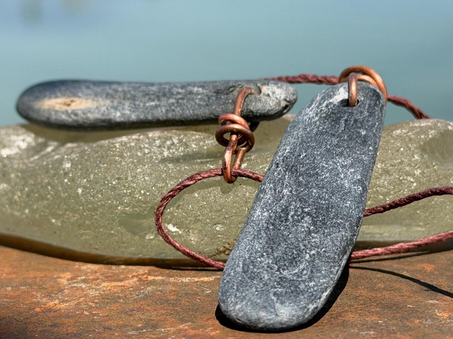 Eco friendly Cornish slate pendants. Earthy, eco and sustainable gift for him. Handmade frey slate necklaces. Handcrafted gifts for men.