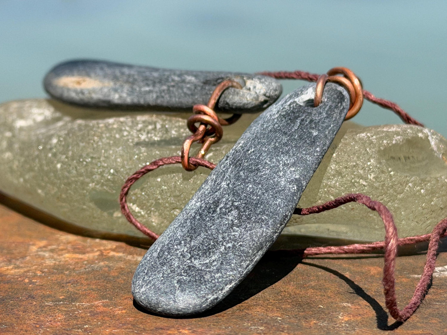 Eco friendly Cornish slate pendants. Earthy, eco and sustainable gift for him. Handmade frey slate necklaces. Handcrafted gifts for men.