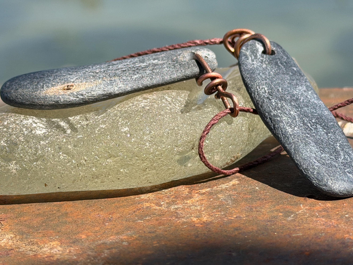Eco friendly Cornish slate pendants. Earthy, eco and sustainable gift for him. Handmade frey slate necklaces. Handcrafted gifts for men.