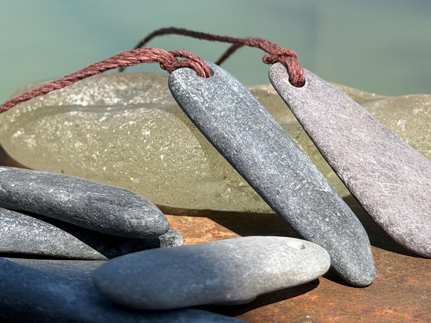 Eco friendly Cornish slate pendants. Earthy, eco and sustainable gift for him. Handmade frey slate necklaces. Handcrafted gifts for men.