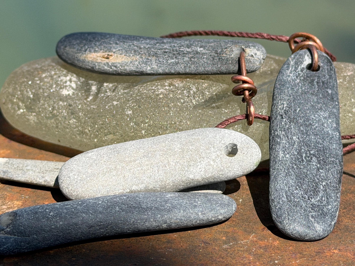Eco friendly Cornish slate pendants. Earthy, eco and sustainable gift for him. Handmade frey slate necklaces. Handcrafted gifts for men.