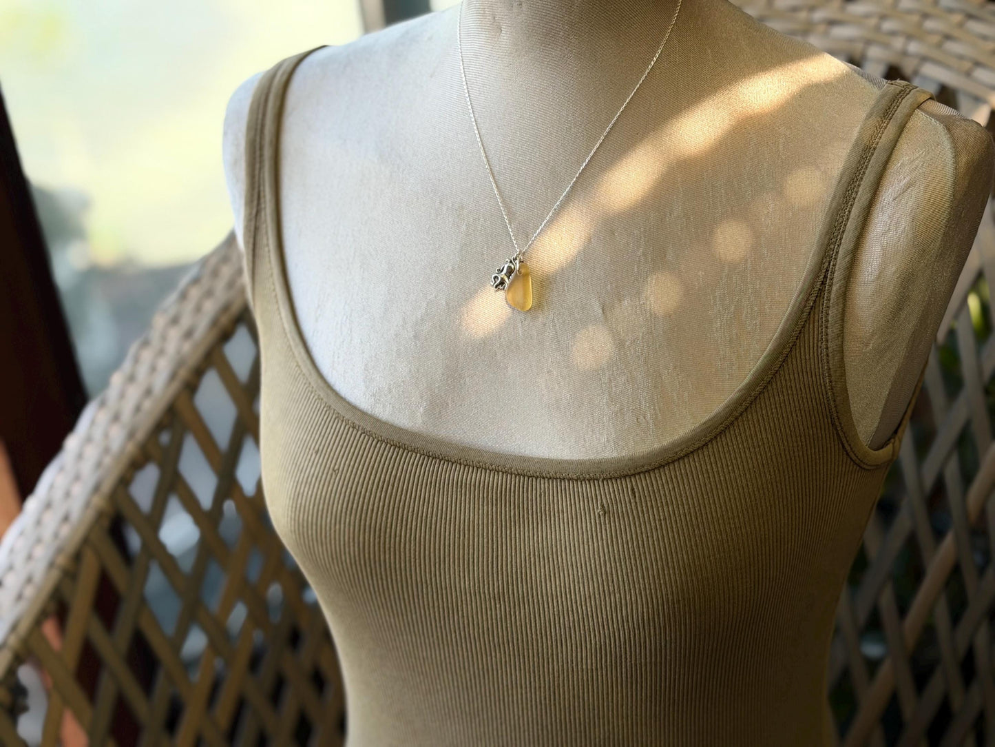 Eco friendly sea glass necklace on a sterling silver chain showcasing a little octopus. Octopus pendant, octopus necklace, eco jewellery
