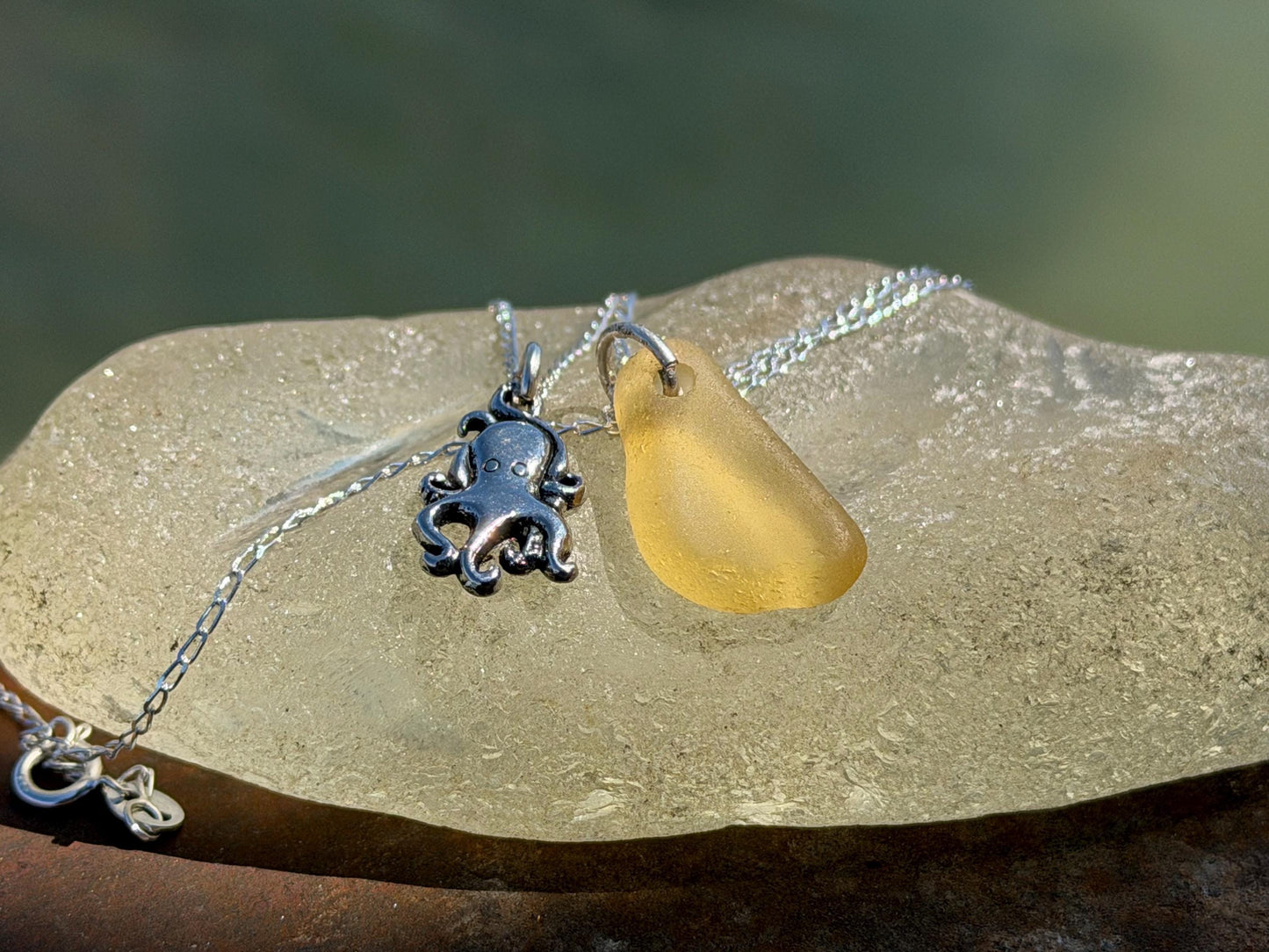Eco friendly sea glass necklace on a sterling silver chain showcasing a little octopus. Octopus pendant, octopus necklace, eco jewellery