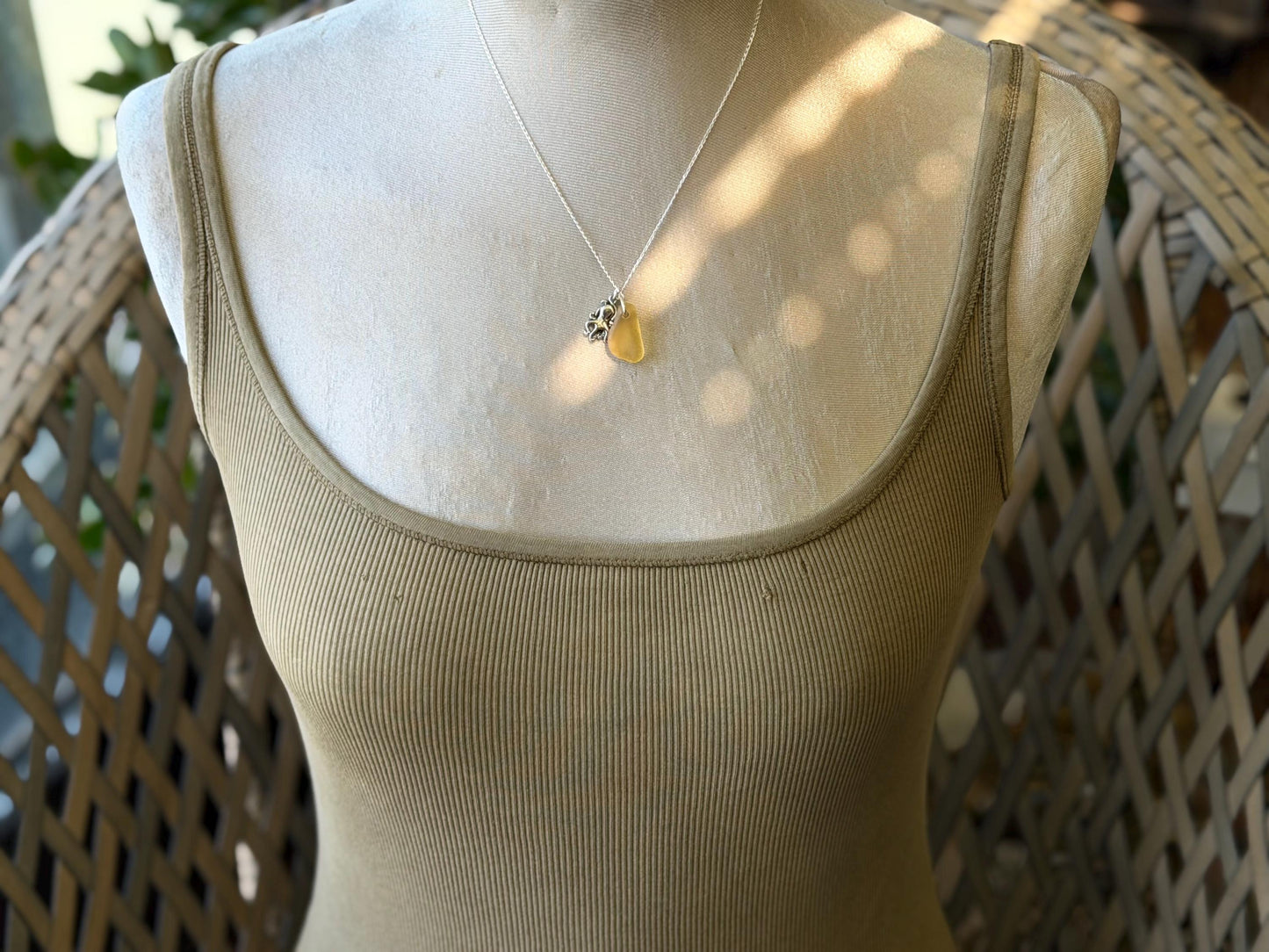 Eco friendly sea glass necklace on a sterling silver chain showcasing a little octopus. Octopus pendant, octopus necklace, eco jewellery
