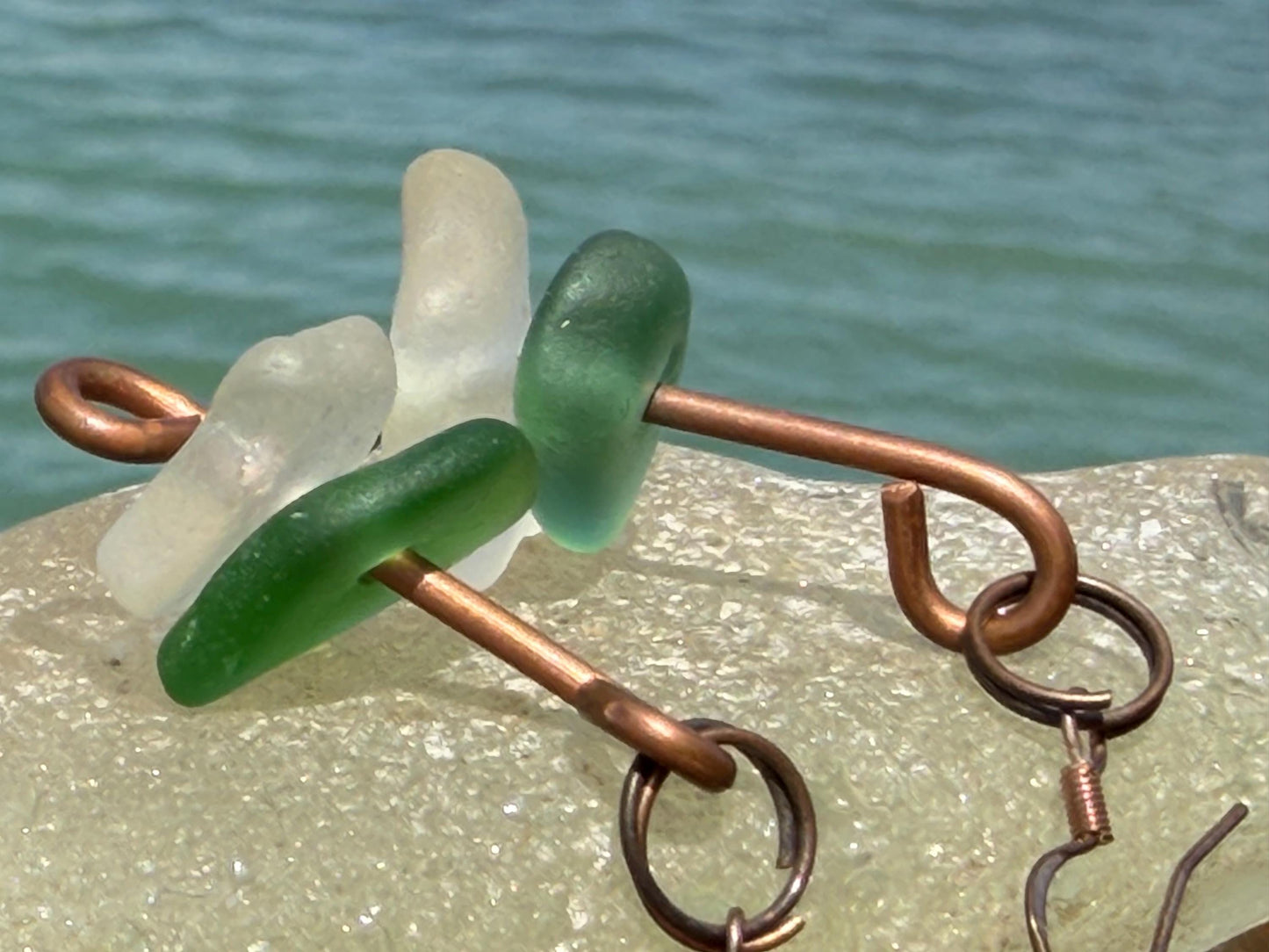 Handmade green & white sea glass on recycled copper. Unique earrings, ethical jewellery, unusual jewellery, eco friendly jewellery.