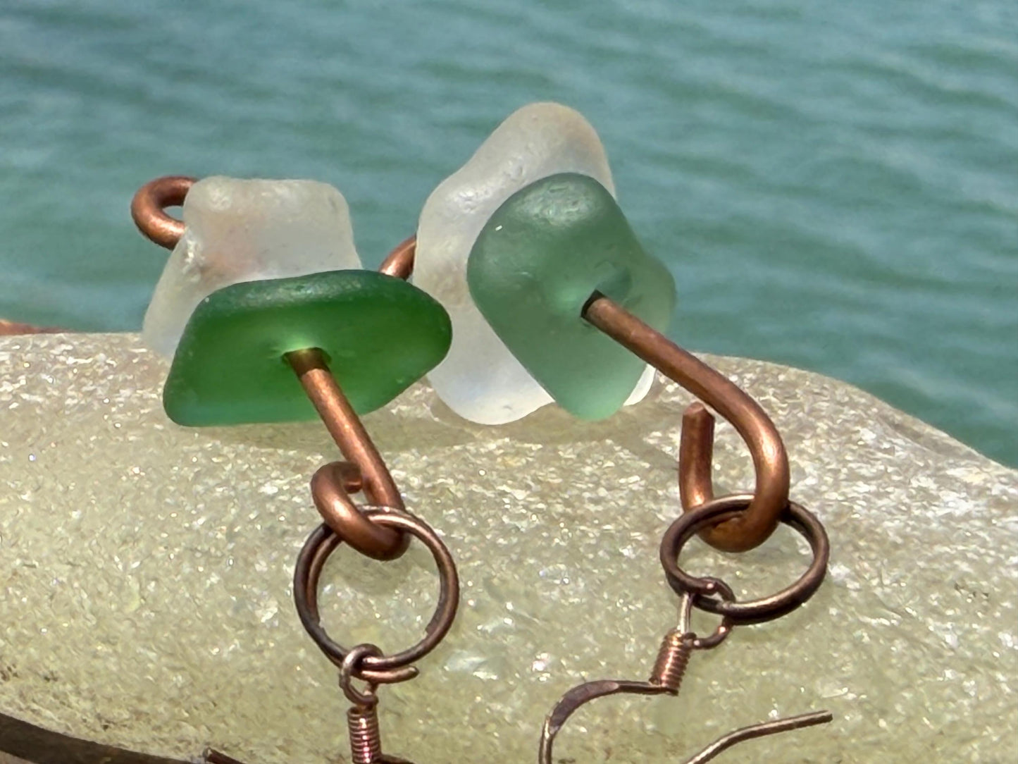 Handmade green & white sea glass on recycled copper. Unique earrings, ethical jewellery, unusual jewellery, eco friendly jewellery.