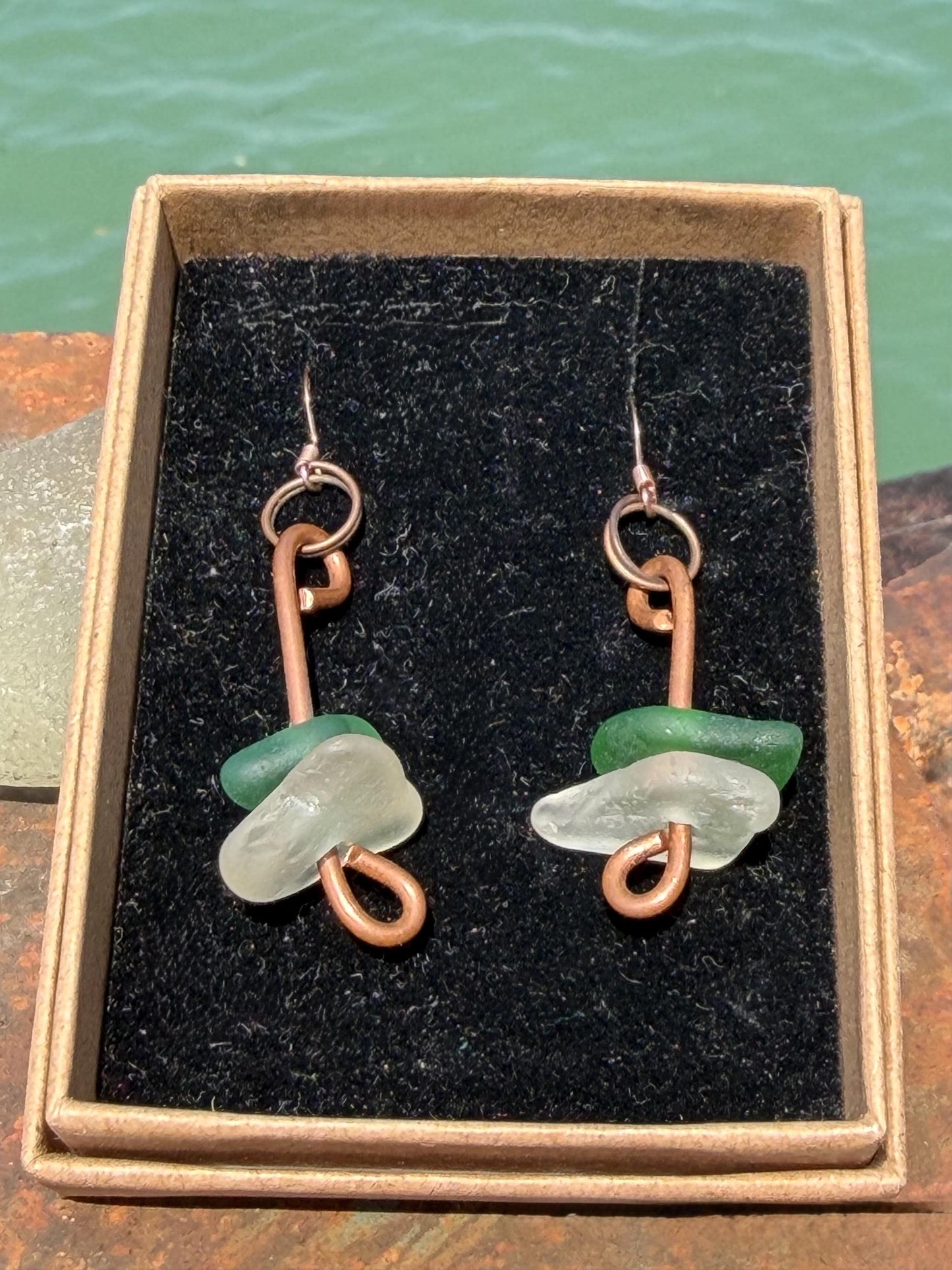 Handmade green & white sea glass on recycled copper. Unique earrings, ethical jewellery, unusual jewellery, eco friendly jewellery.
