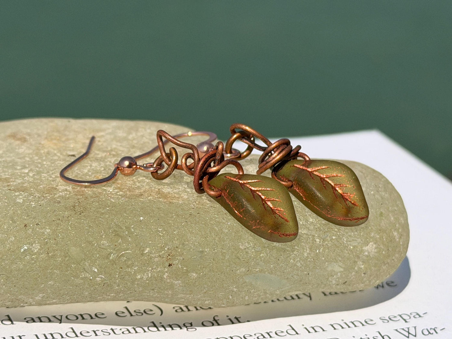 Upcycled glass leaves wrapped in recycled copper. Held on rose gold ear hooks. Eco friendly jewellery. Unique earrings. Leaf earrings.