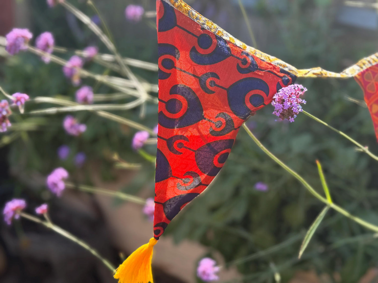 Recycled bunting with long ties and tassels. Boho bunting for home, garden and parties. Party flags with tassels.  Colourful  & eco friendly