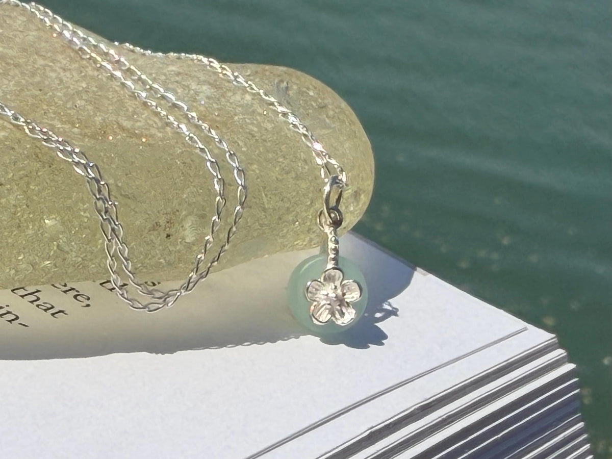 Dainty little recycled glass necklace within sterling silver flower. Recycled necklace. Ethical jewellery. glass pendant. Eco friendly gifts