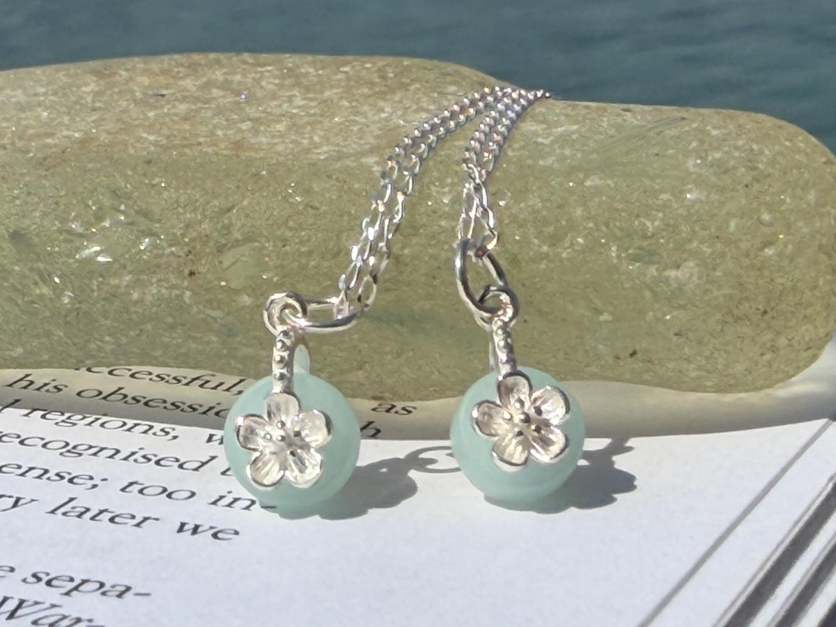 Dainty little recycled glass necklace within sterling silver flower. Recycled necklace. Ethical jewellery. glass pendant. Eco friendly gifts