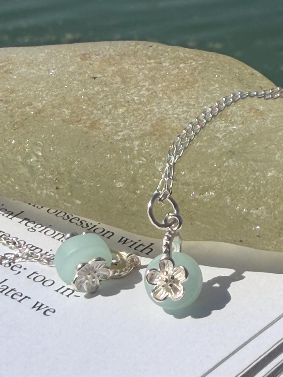 Dainty little recycled glass necklace within sterling silver flower. Recycled necklace. Ethical jewellery. glass pendant. Eco friendly gifts