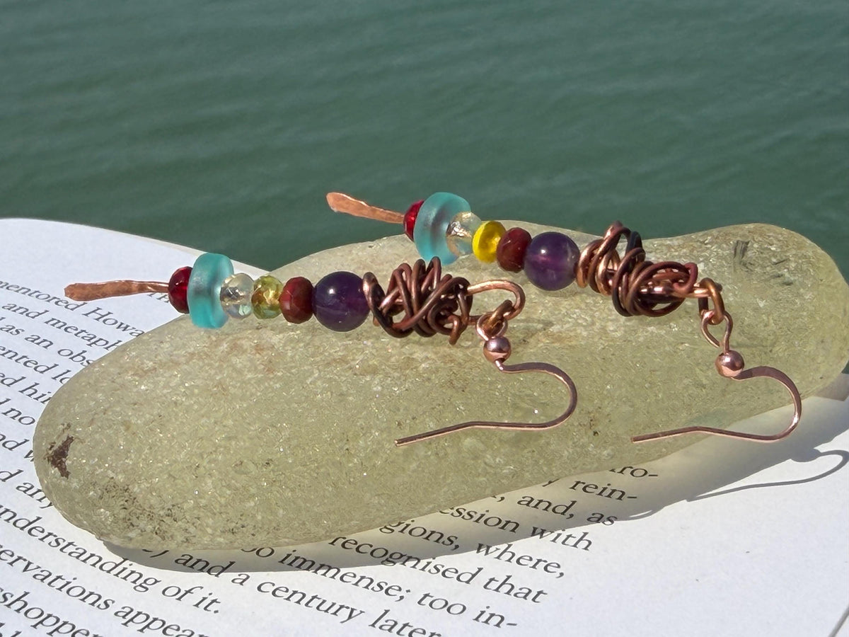 Eco friendly earrings made using recycled copper, sea glass & ethically sourced amethyst. Handmade ethical and unique jewellery.  Unusual.