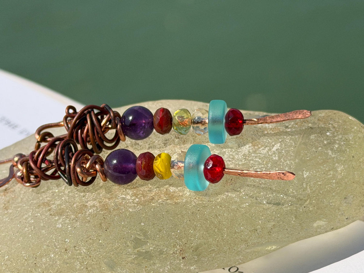 Eco friendly earrings made using recycled copper, sea glass & ethically sourced amethyst. Handmade ethical and unique jewellery.  Unusual.