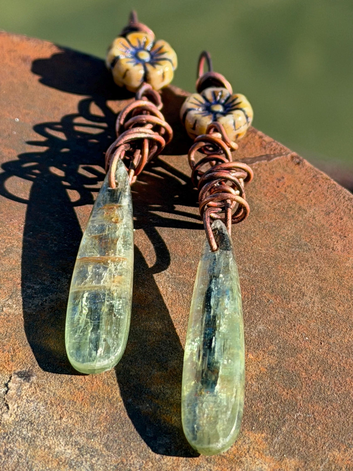 Green kyanite earrings hung on recycled copper. Unique gemstone jewellery. handmade unusual jewellery, ethically made. Eco friendly earrings