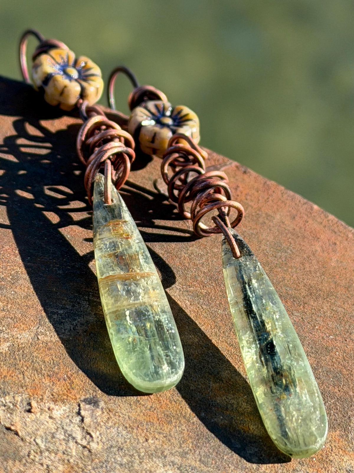 Green kyanite earrings hung on recycled copper. Unique gemstone jewellery. handmade unusual jewellery, ethically made. Eco friendly earrings