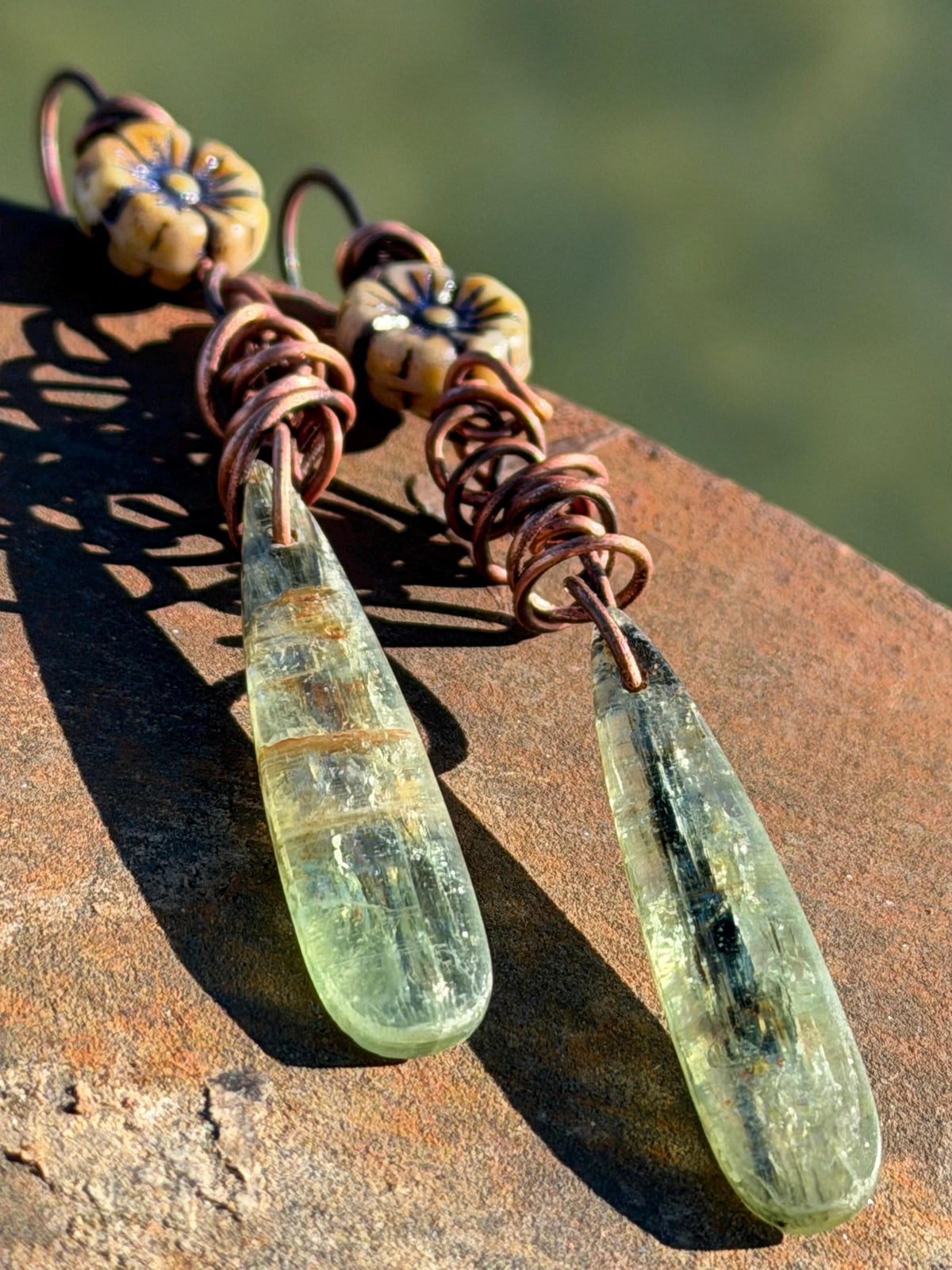 Green kyanite earrings hung on recycled copper. Unique gemstone jewellery. handmade unusual jewellery, ethically made. Eco friendly earrings